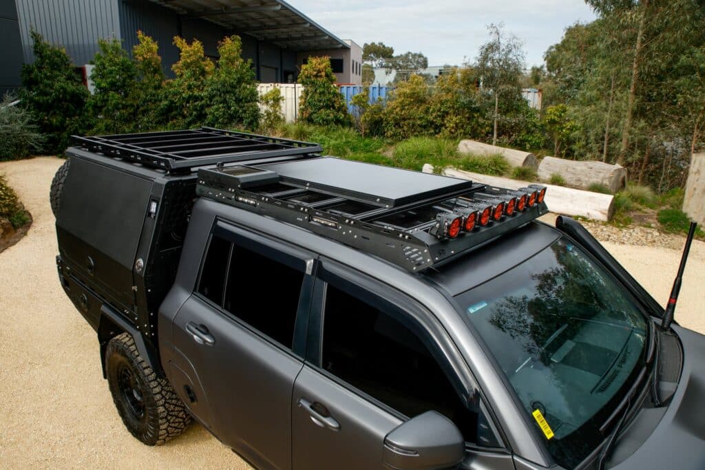 Close-up of the Boss LC300 JMACX Chop Cab Rack mounted on the roof with integrated side lighting