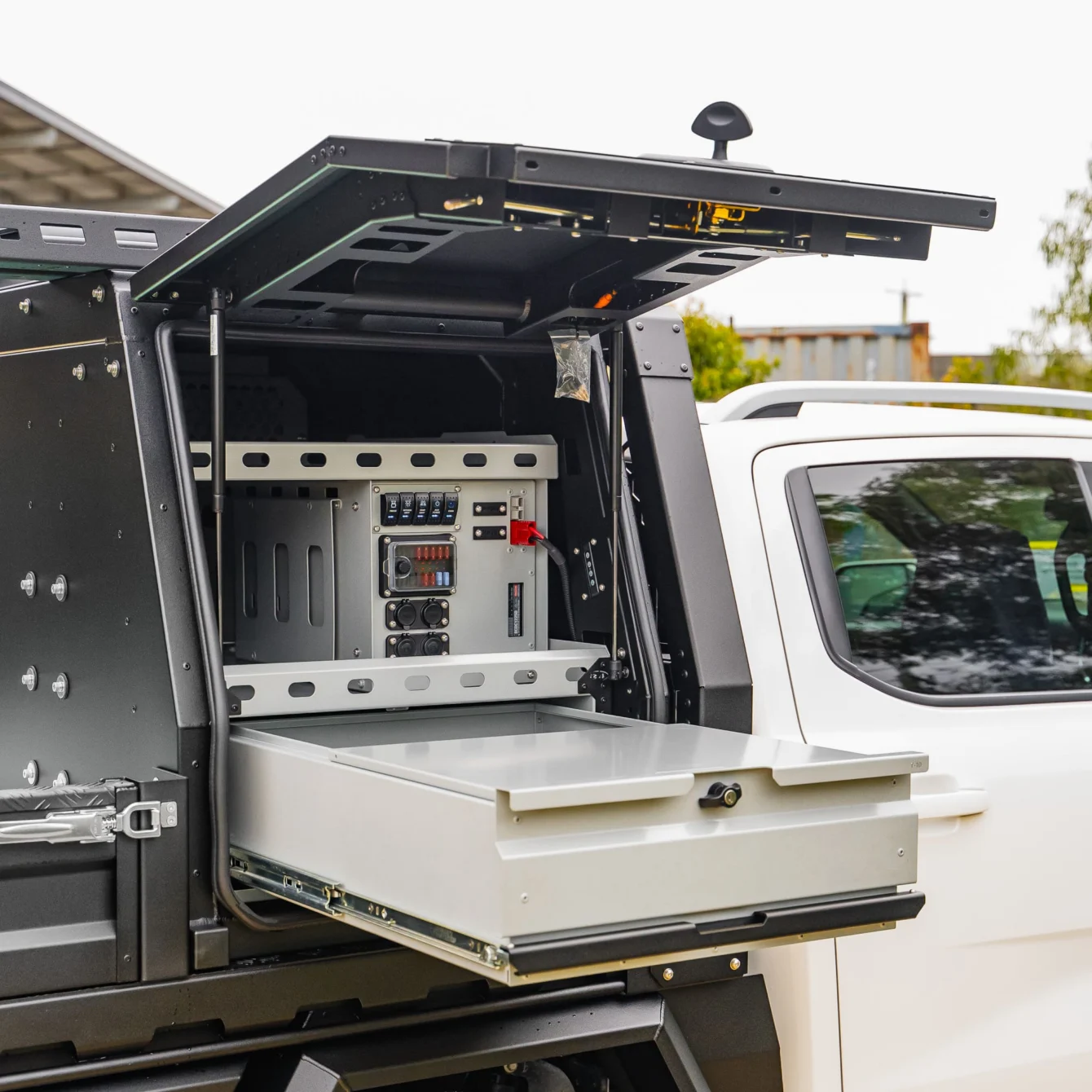 Boss canopy door open over a drawer and power module