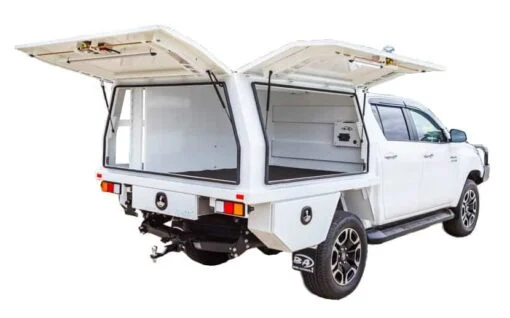 White Toyota HiLux with a Boss tray and three-door canopy, doors raised