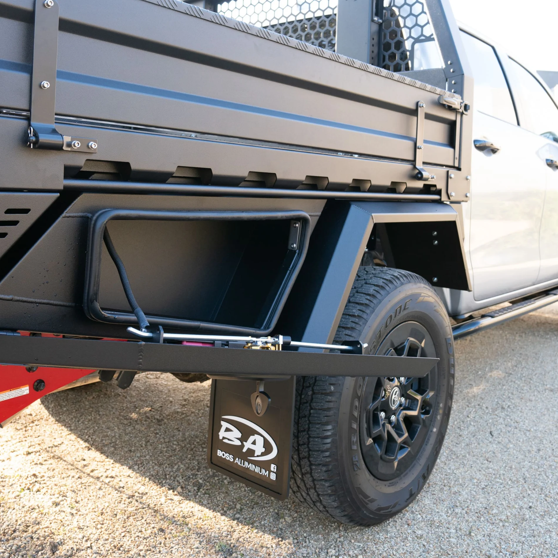 Boss underbody box beneath a black tray